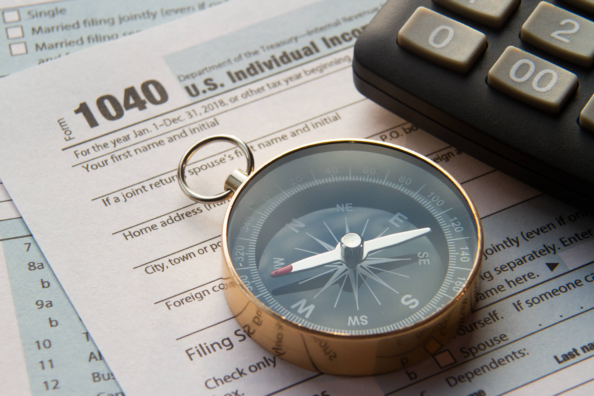 compass, calculator, 1040 tax form, strategic tax resolution