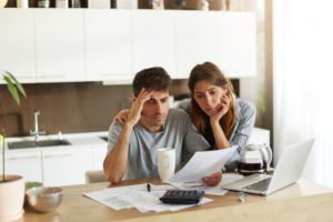 worried couple, debt collection, tax debt, private collection agency, irs, taxes